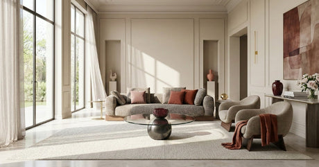 Italian living room with round glass coffee table and metal base.